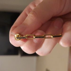 A pair of gold and black diamond drop earrings